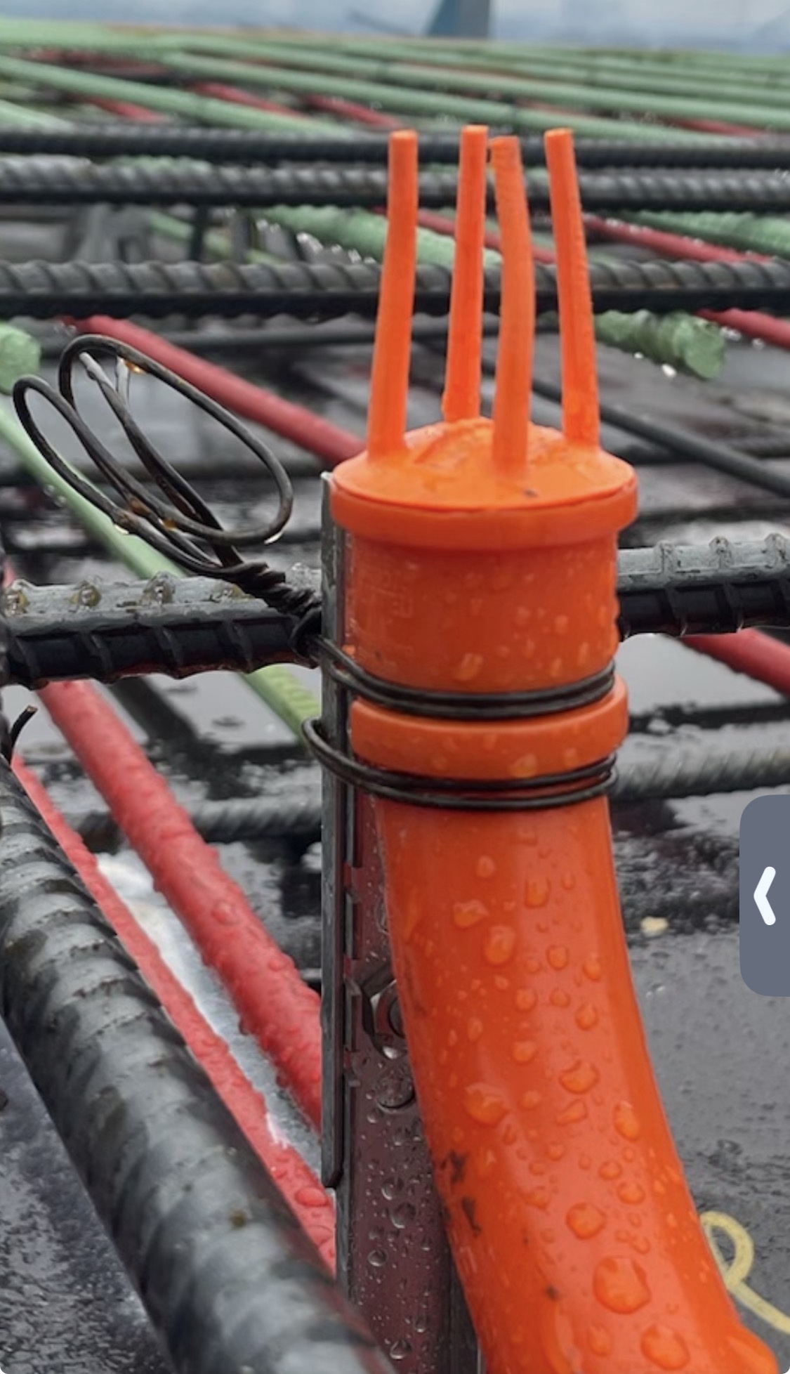 Stub-EASE II™ with tie wire wrapped at collar flanges on active rebar deck — standard securing method
