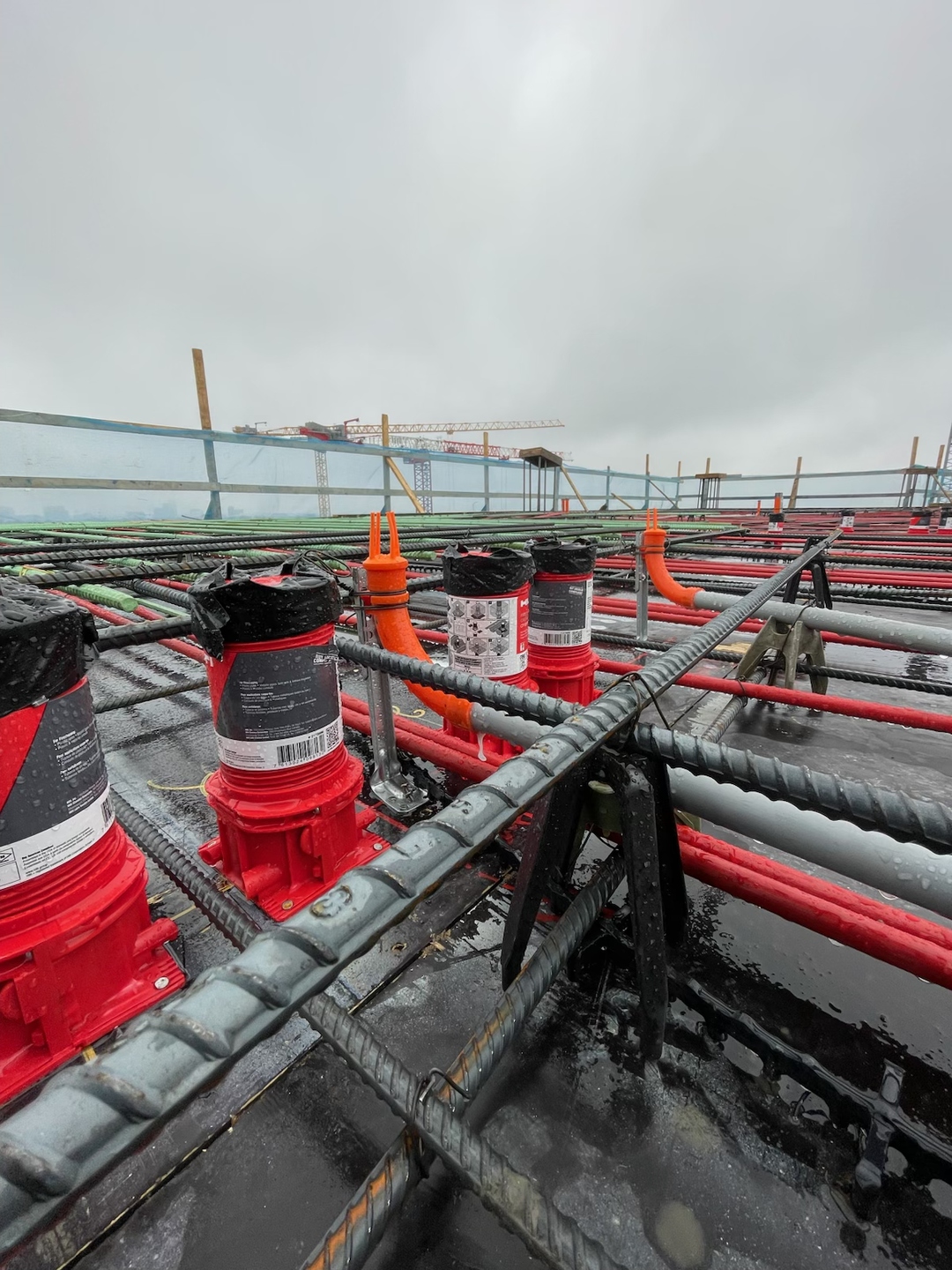 Stub-EASE II™ systems installed and secured across an active high-rise rebar deck, caps on, ready for concrete pour